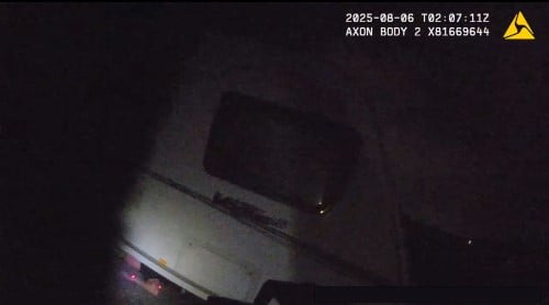Suspect hiding under caravan