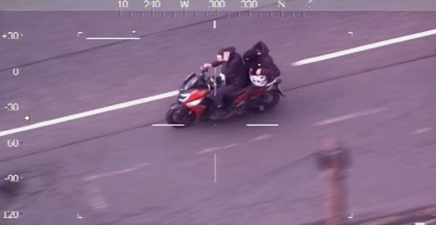 A screenshot from the police helicopter showing the two suspects on the bike