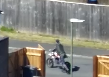 Drone footage of the suspect with the bike in the street