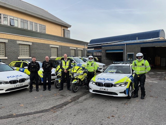Members of DRAP with police cars