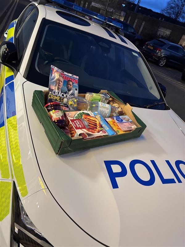 The shopping on the bonnet of a police car