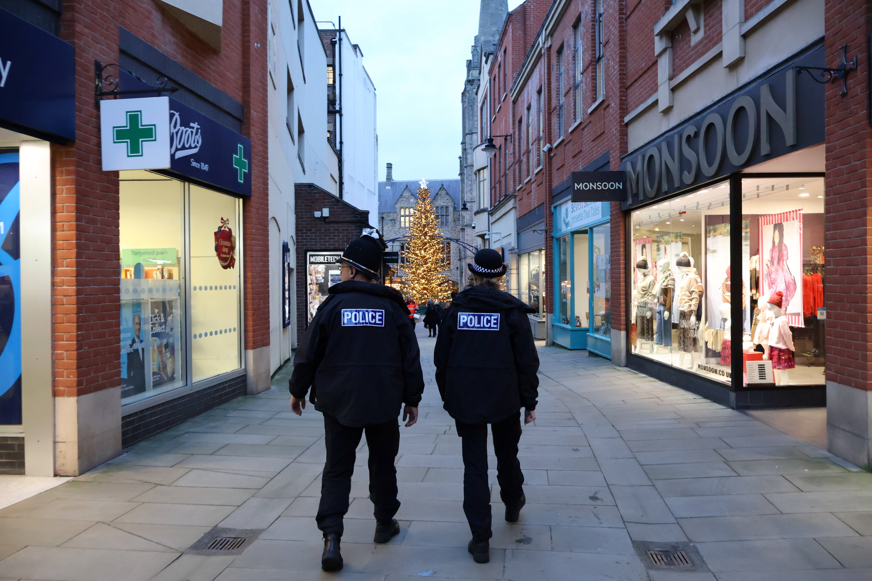Officers walk in Durham City