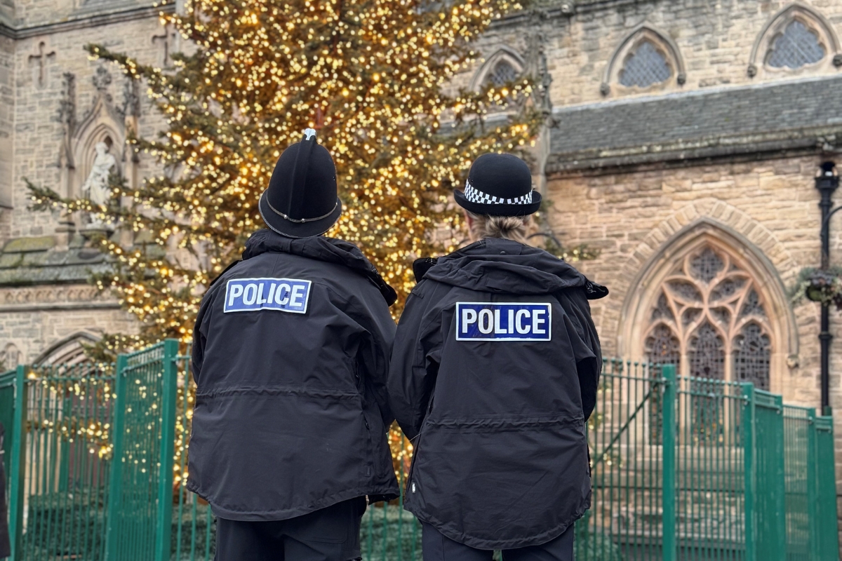 Police looking at Christmas tree