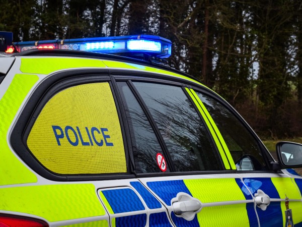 Police car with blue lights on 