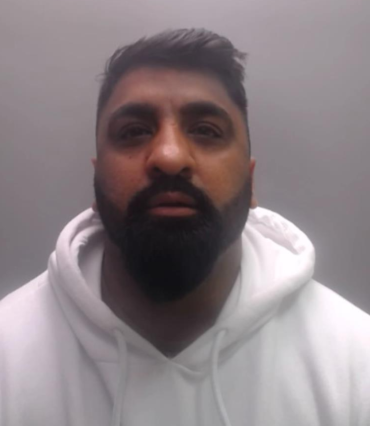 Khan mugshot